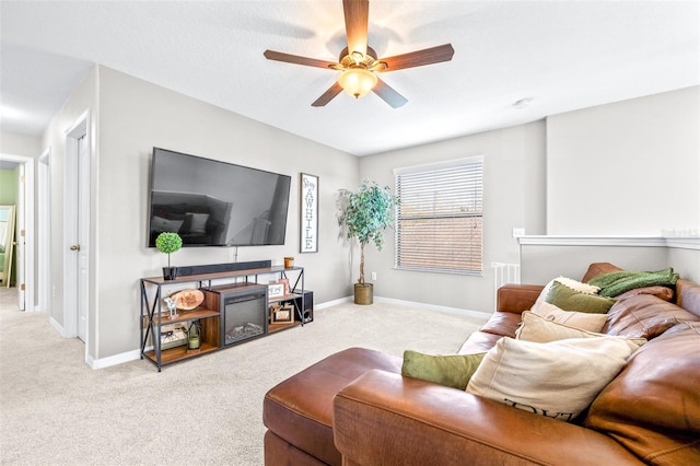 living room with light colored carpet and ceiling fan