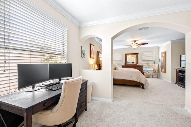 bedroom with crown molding, light colored carpet, and ceiling fan