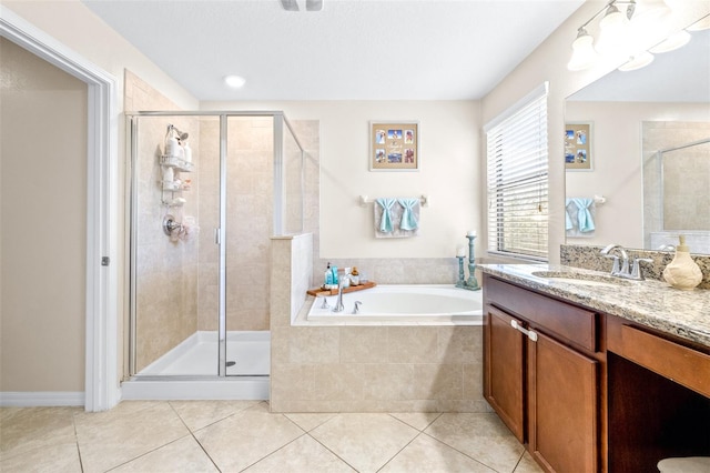 bathroom with vanity, shower with separate bathtub, and tile patterned flooring