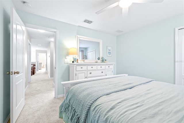 bedroom featuring light carpet and ceiling fan