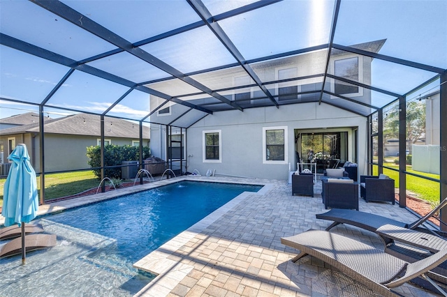 view of swimming pool featuring a patio area, outdoor lounge area, pool water feature, and glass enclosure