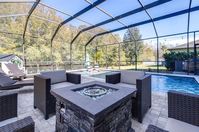 view of patio / terrace featuring a fenced in pool, a lanai, and an outdoor fire pit