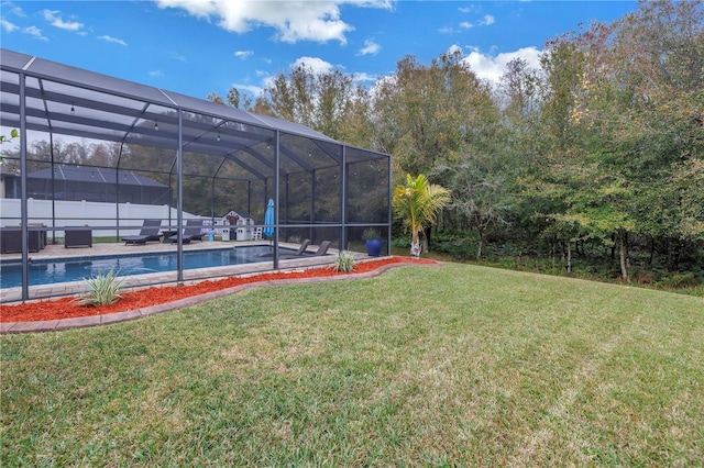 view of yard with a patio and glass enclosure