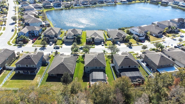 birds eye view of property featuring a water view