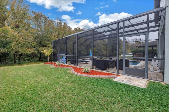 view of yard with a patio area and glass enclosure