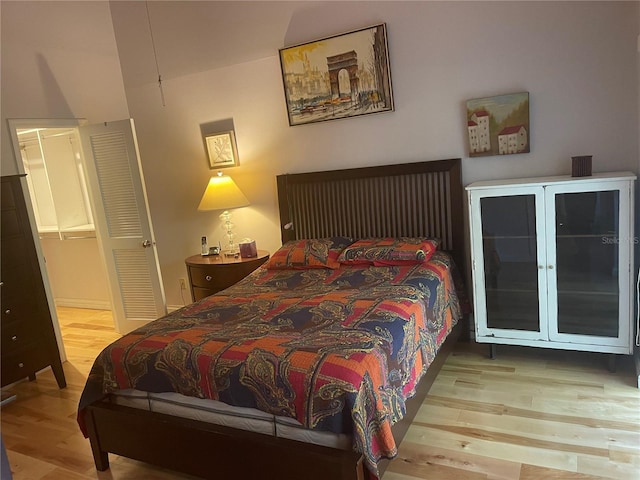 bedroom featuring light hardwood / wood-style floors and a closet