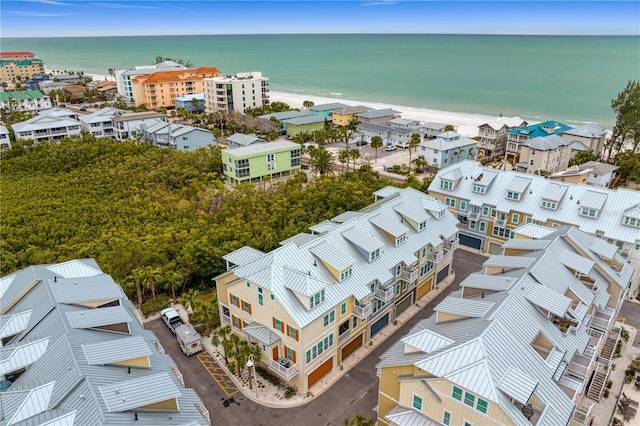 bird's eye view with a water view and a view of the beach