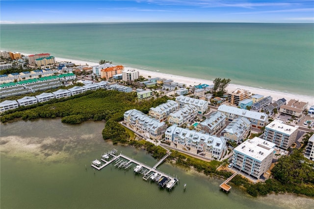 birds eye view of property featuring a water view and a view of the beach