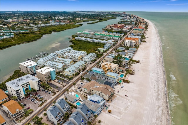 birds eye view of property featuring a water view and a view of the beach