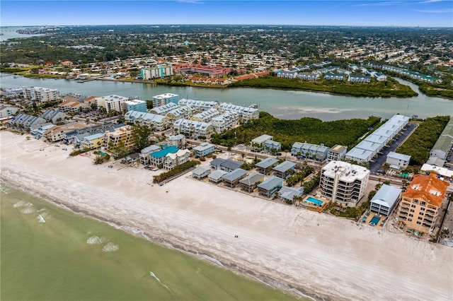 bird's eye view with a water view and a beach view