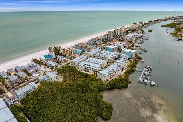 drone / aerial view with a water view and a view of the beach