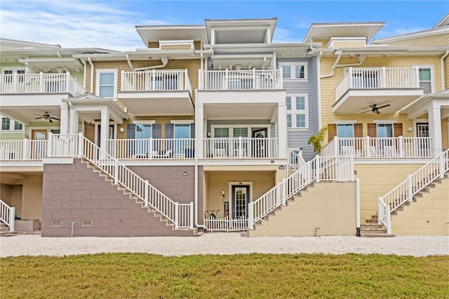 rear view of house with ceiling fan