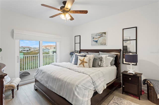 bedroom featuring access to exterior, ceiling fan, and light hardwood / wood-style flooring