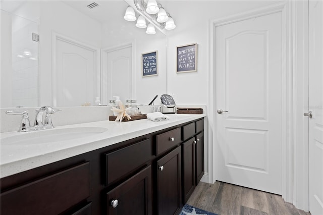 bathroom featuring vanity and wood-type flooring