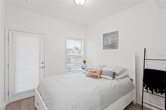 bedroom with hardwood / wood-style floors