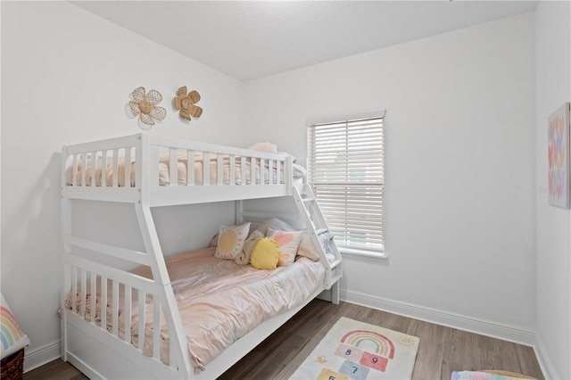 bedroom featuring dark wood-type flooring