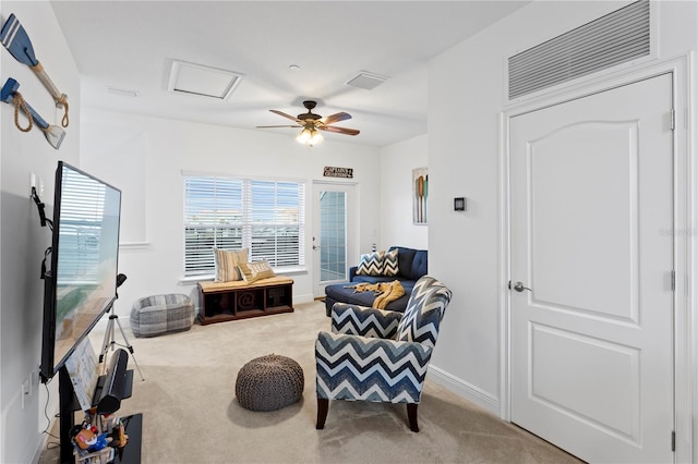 sitting room with light carpet and ceiling fan