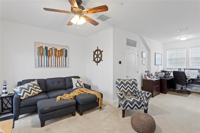 living room featuring light carpet and ceiling fan