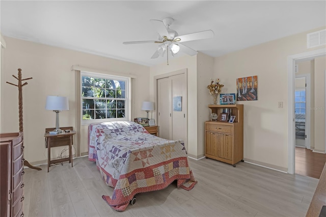 bedroom with light wood-type flooring and ceiling fan