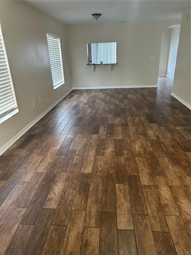 spare room featuring dark hardwood / wood-style flooring