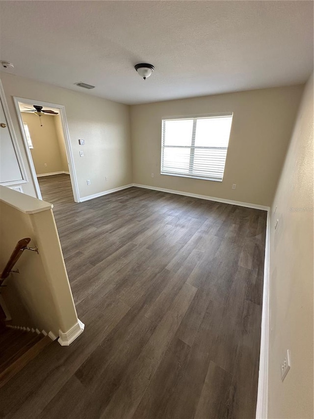 spare room featuring dark hardwood / wood-style flooring