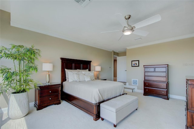 carpeted bedroom featuring crown molding and ceiling fan