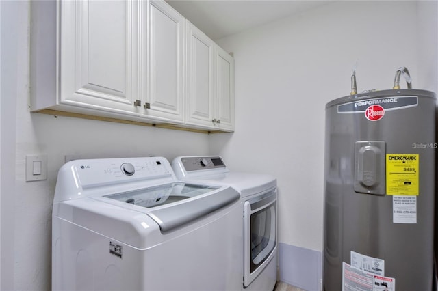 washroom featuring water heater, cabinets, and independent washer and dryer