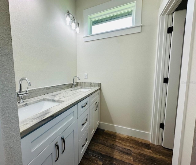 bathroom with hardwood / wood-style flooring and vanity