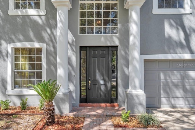 property entrance featuring a garage