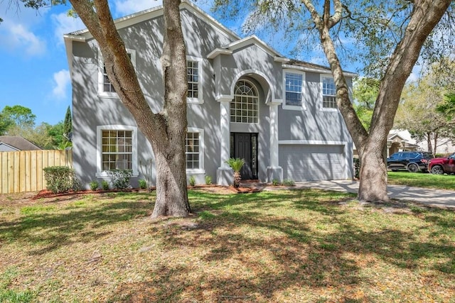 view of front of home featuring a garage and a front yard