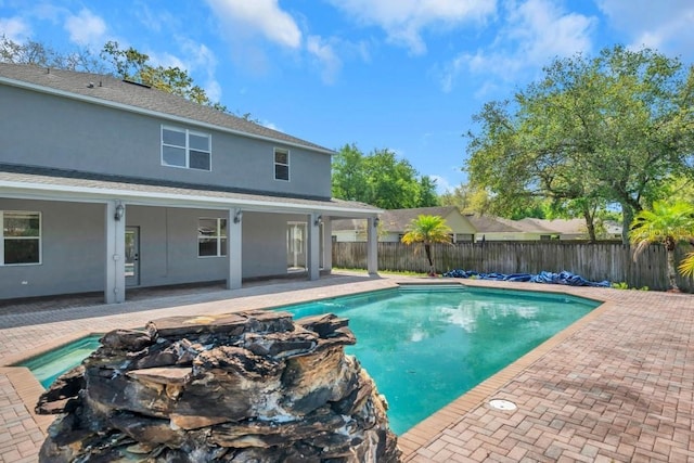 view of swimming pool with a patio area