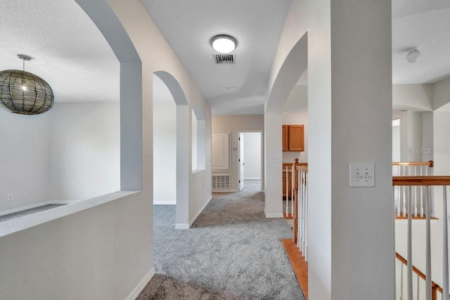 hallway with light carpet