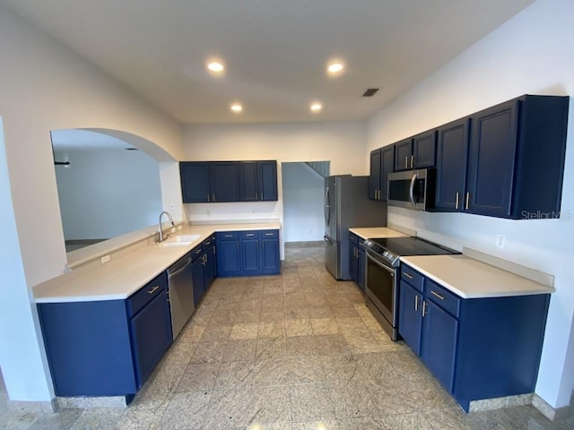 kitchen featuring stainless steel appliances, blue cabinets, and sink