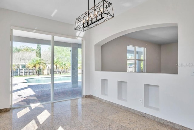 unfurnished dining area with a healthy amount of sunlight