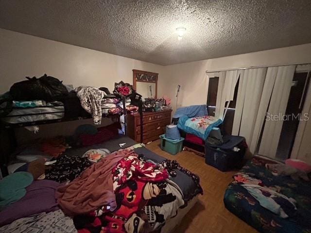 bedroom featuring a textured ceiling