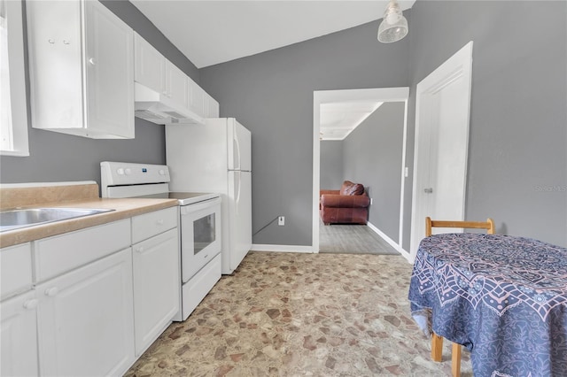 kitchen featuring white cabinets, white electric stove, and vaulted ceiling