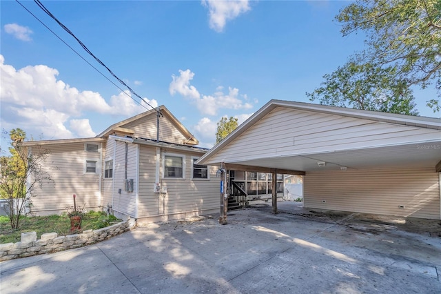 exterior space with a carport