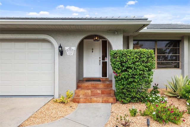 doorway to property featuring a garage