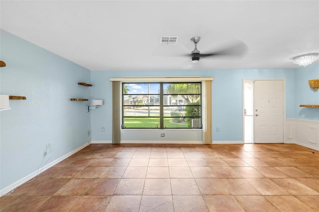 interior space featuring ceiling fan and light tile patterned floors