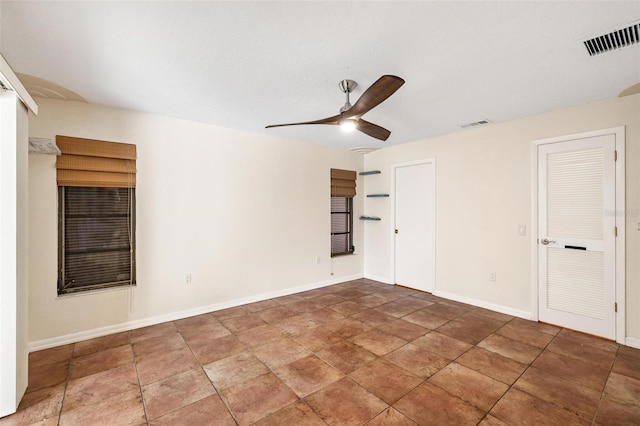 empty room featuring ceiling fan