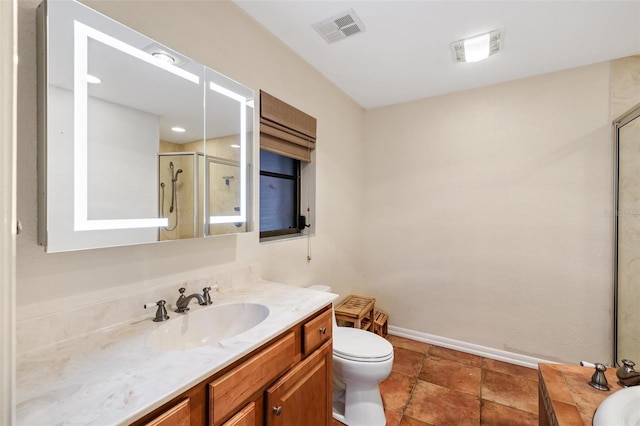 bathroom featuring vanity, toilet, and walk in shower