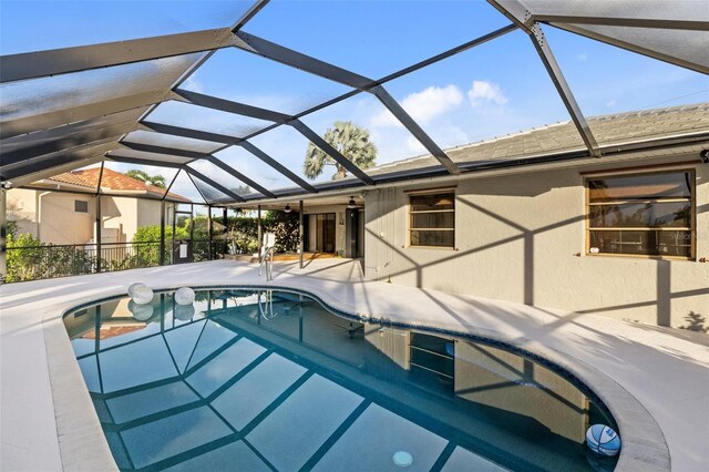 view of pool featuring a patio and glass enclosure