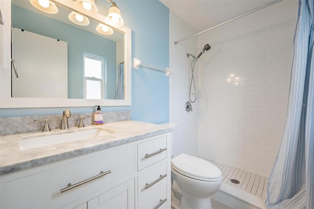 bathroom with vanity, toilet, and walk in shower