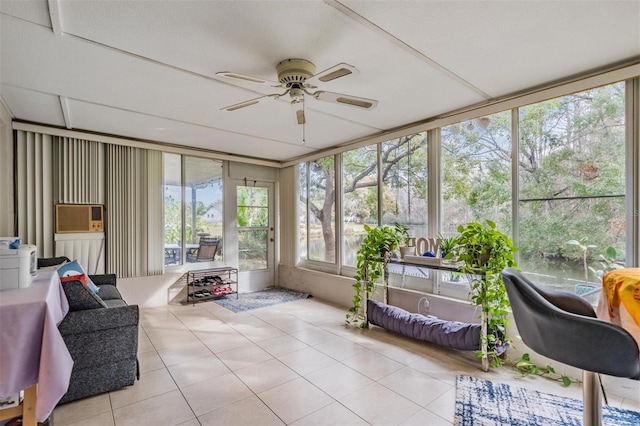 sunroom featuring ceiling fan