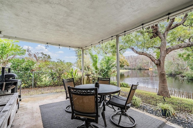 view of patio / terrace with a water view