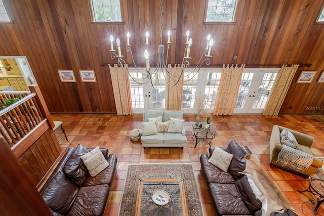 living room with a wealth of natural light and wood walls