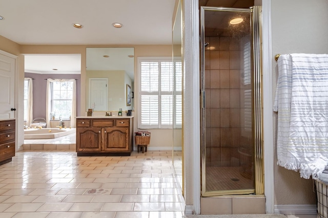 bathroom with independent shower and bath, vanity, and tile patterned floors