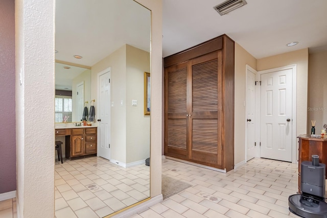 bathroom featuring vanity and tile patterned flooring