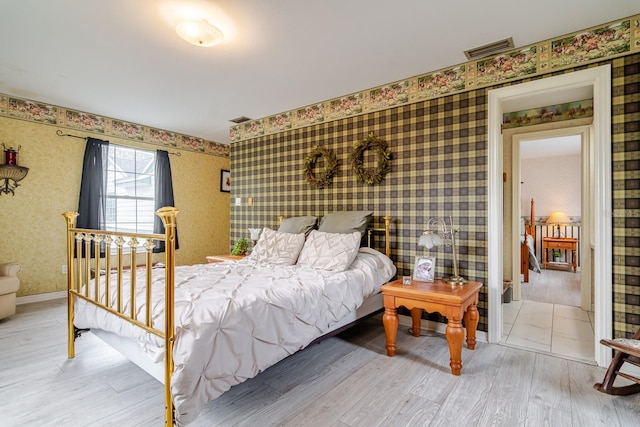 bedroom with hardwood / wood-style flooring