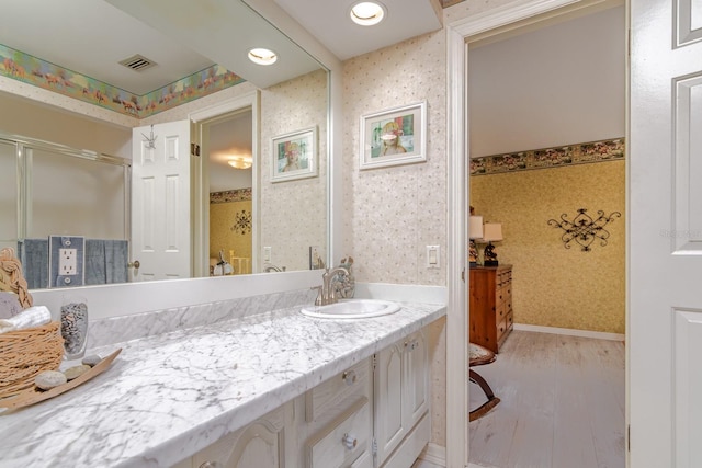 bathroom featuring vanity and wood-type flooring